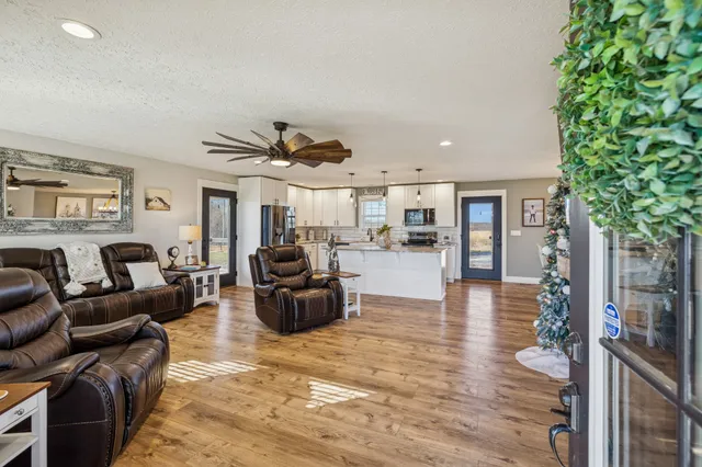 a living room with furniture or couch and a potted plant