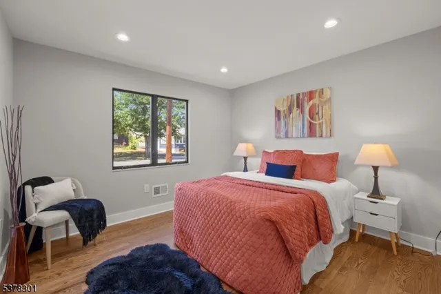 a bedroom with bed and a window