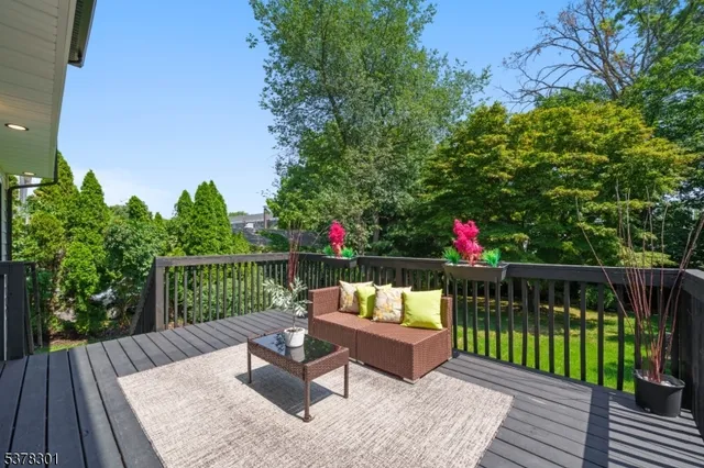 a view of a wooden deck with furniture