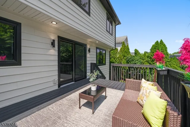 a view of a chairs and tables in the balcony
