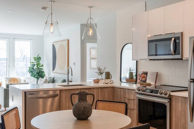 a kitchen with a sink stove and microwave