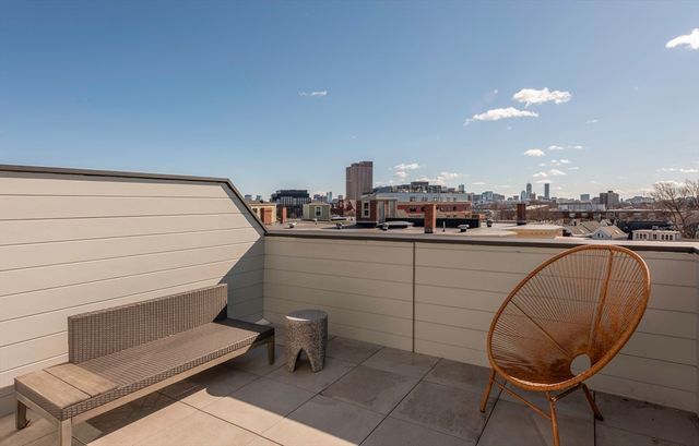a room with a chair and tables