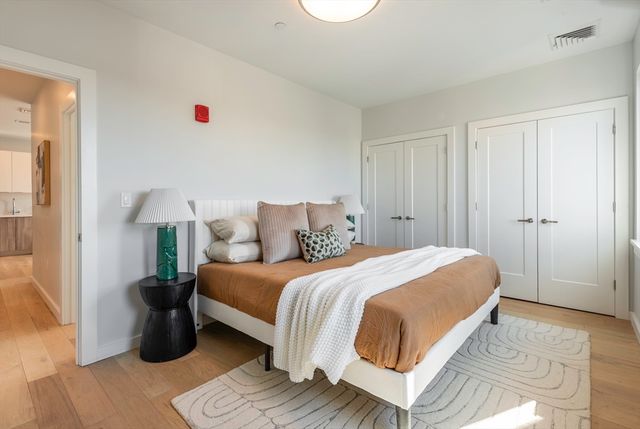 a bedroom with a bed and a couch