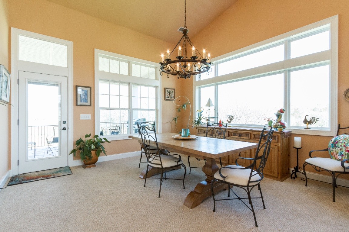 2330 Berea Church Road Lebanon, TN 37087 - Photo 5 of 22 a dining room with furniture a chandelier and a rug