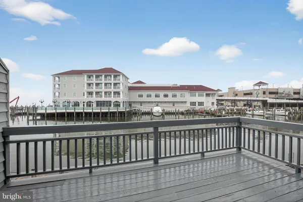 a view of a balcony with wooden floor