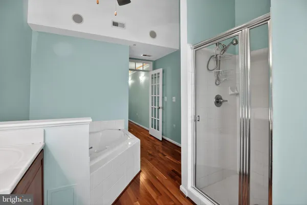 a bathroom with a bathtub and a shower