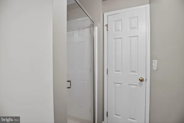 a view of a storage & utility room with dryer and washer