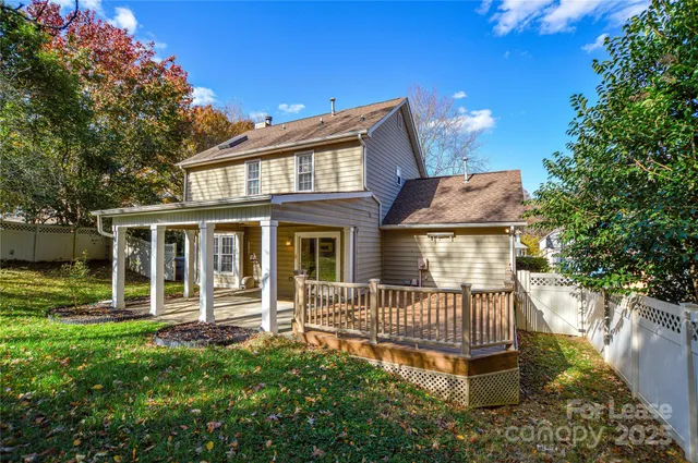 a view of a hall with a floor to ceiling window and an outdoor space