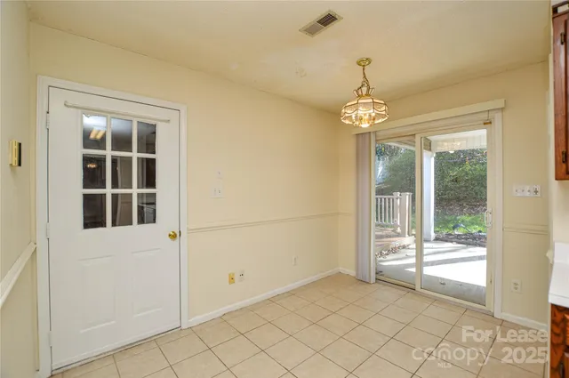 a view of a hallway with windows