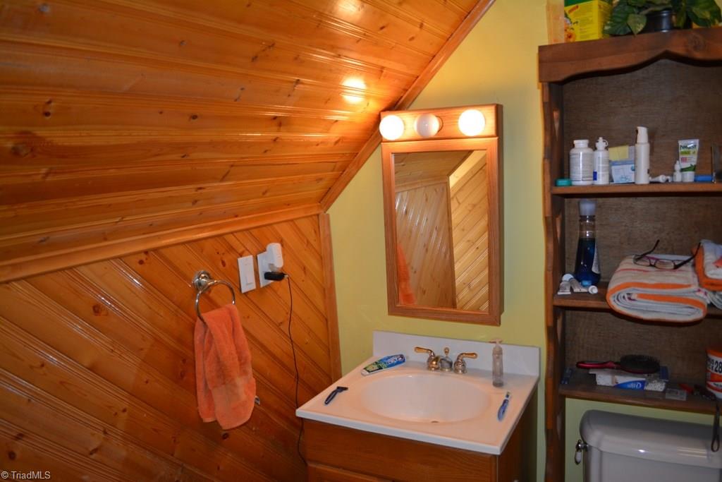 390 Mitchell Ridge Road Elkin, NC 28621 - Photo 12 of 20 Upstairs bathroom is accented with neat wood trim.
