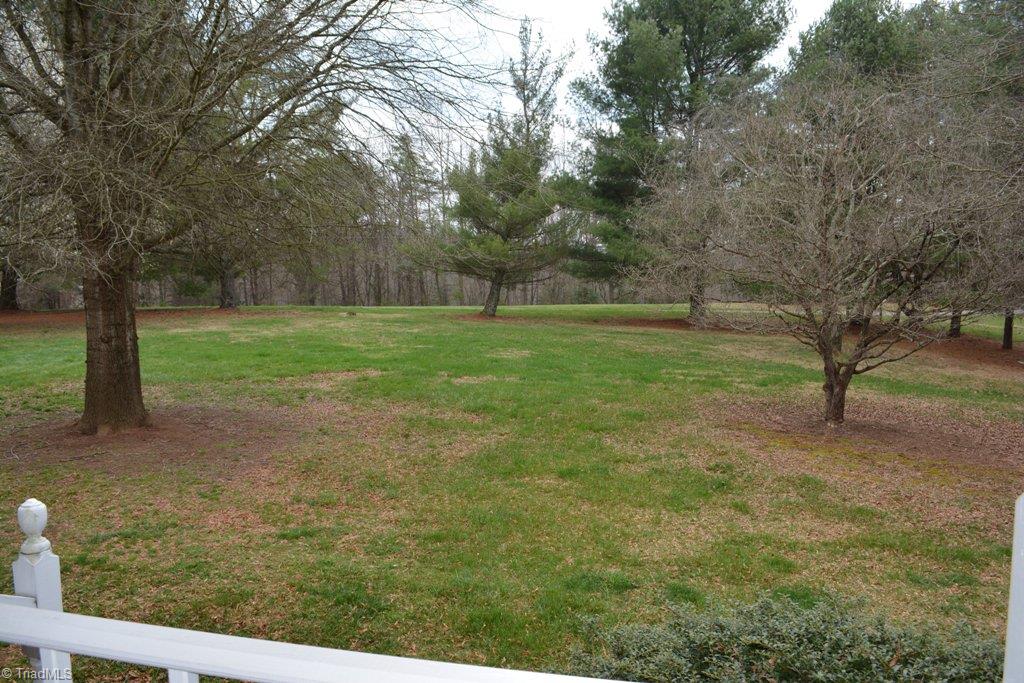 390 Mitchell Ridge Road Elkin, NC 28621 - Photo 3 of 20 View of the spacious front yard, looking out from the porch.