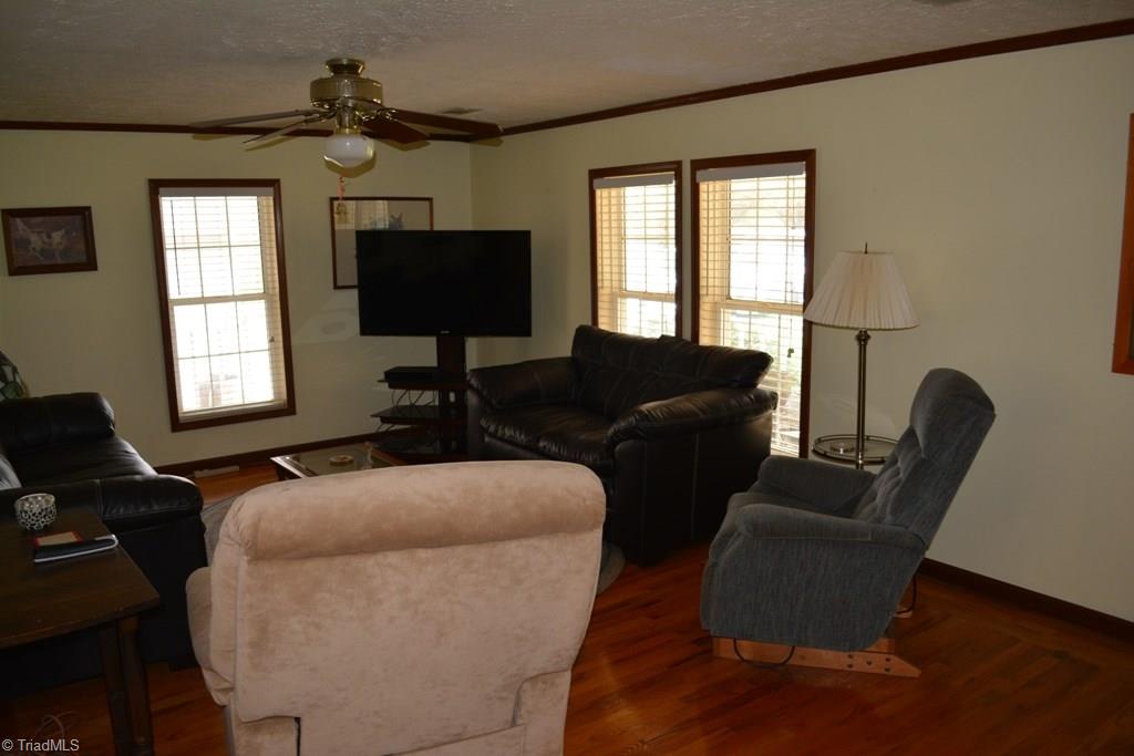 390 Mitchell Ridge Road Elkin, NC 28621 - Photo 7 of 20 Spacious living room! Note the oak hardwood flooring.