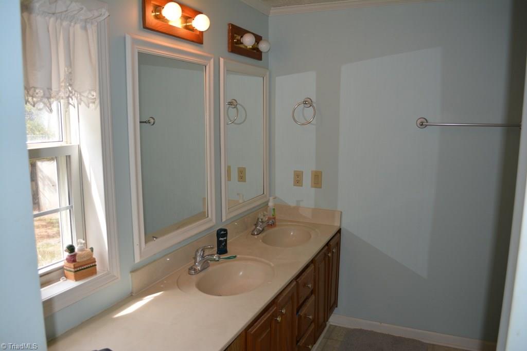 390 Mitchell Ridge Road Elkin, NC 28621 - Photo 9 of 20 Master bath has a double vanity.