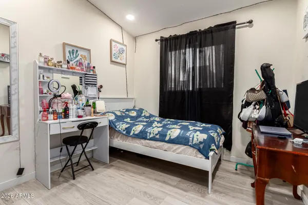 a bedroom with furniture and a bed
