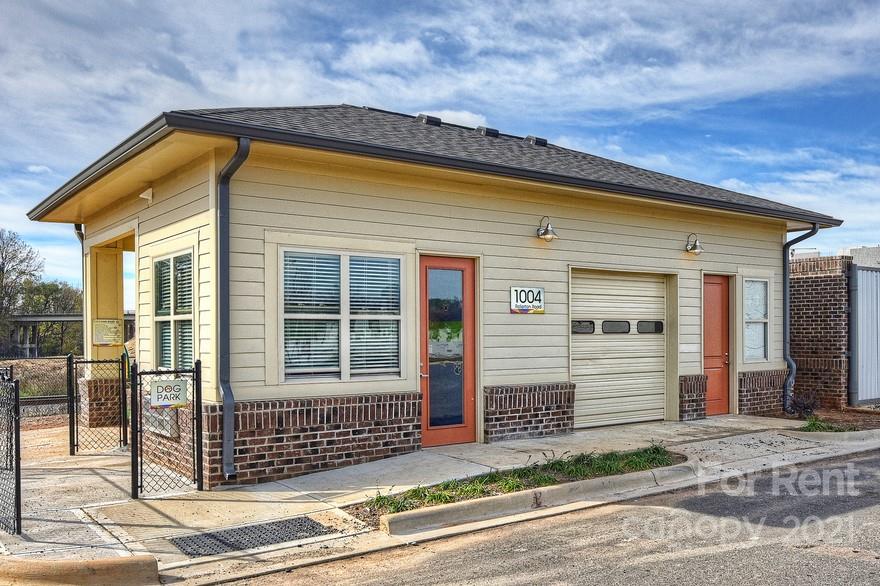 703 Rollerton Road Charlotte, NC 28205 - Photo 20 of 27 a front view of a house with a garage