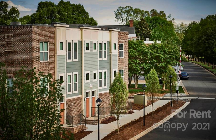 703 Rollerton Road Charlotte, NC 28205 - Photo 3 of 27 a view of a large building with a tree