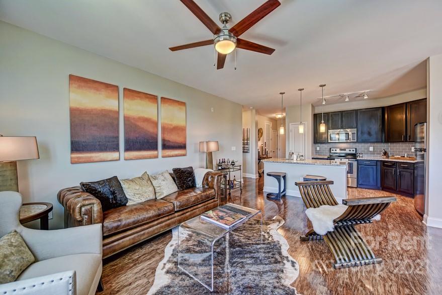 703 Rollerton Road Charlotte, NC 28205 - Photo 7 of 27 a living room with furniture and a view of kitchen