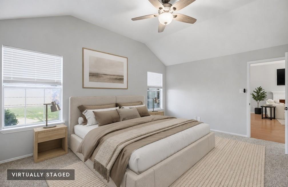 2074 Briarcliff Road Lewisville, TX 75067 - Photo 7 of 40 Spacious room featuring vaulted ceilings, light gray wall paint, and a ceiling fan with integrated lighting - virtually staged