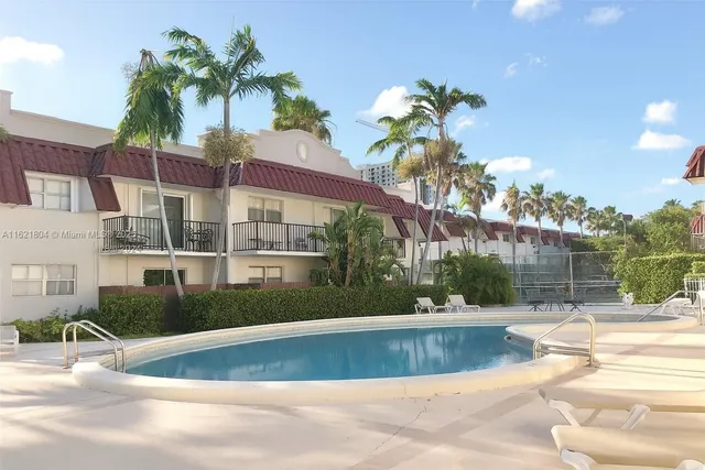 a front view of a house with a swimming pool