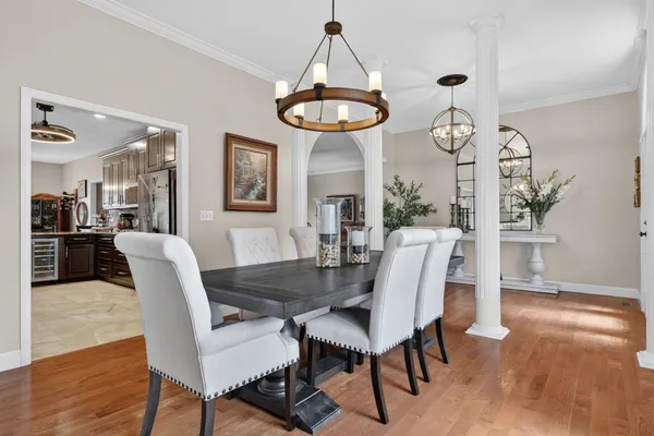 a kitchen with granite countertop a sink stove and cabinets