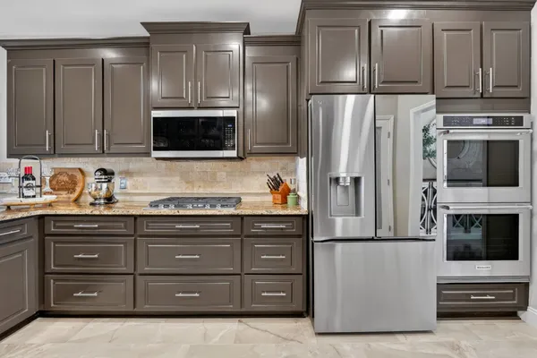 a kitchen with a table and chairs in it