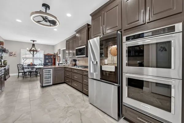 a kitchen with a refrigerator and dishwasher