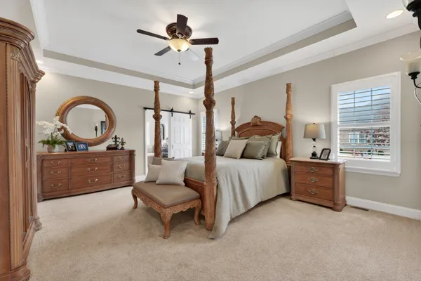 a spacious bathroom with a bathtub sink and mirror