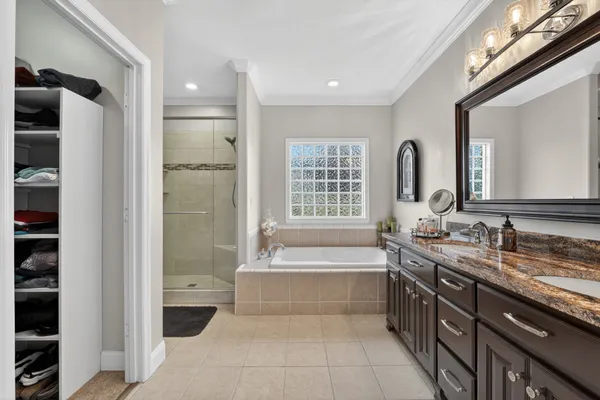 a white bath tub sitting next to a window