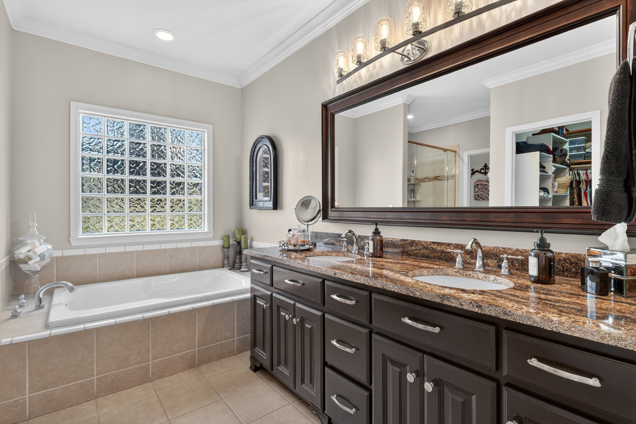19 Hancock Road Fayetteville, TN 37334 - Photo 28 of 54 a bathroom with a granite countertop bathtub a double vanity sink and a large mirror