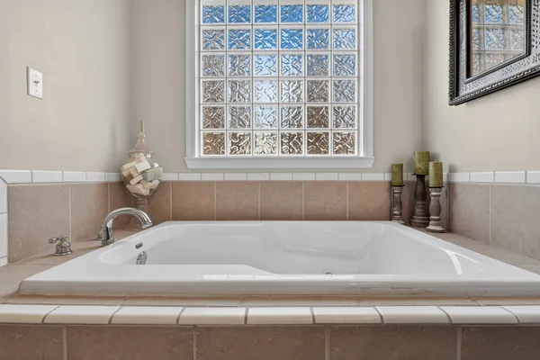 a bathroom with a glass shower door