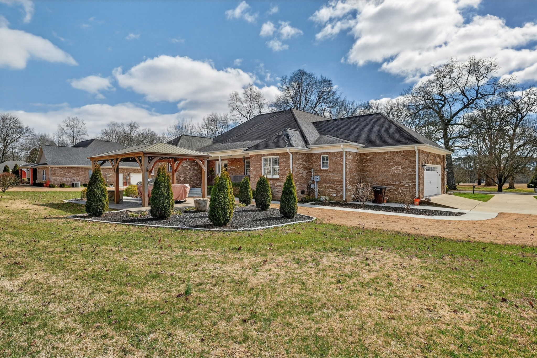 19 Hancock Road Fayetteville, TN 37334 - Photo 44 of 54 a view of a house with a yard patio and a garden