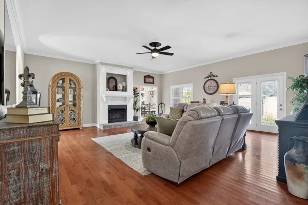 a living room with furniture fireplace and window
