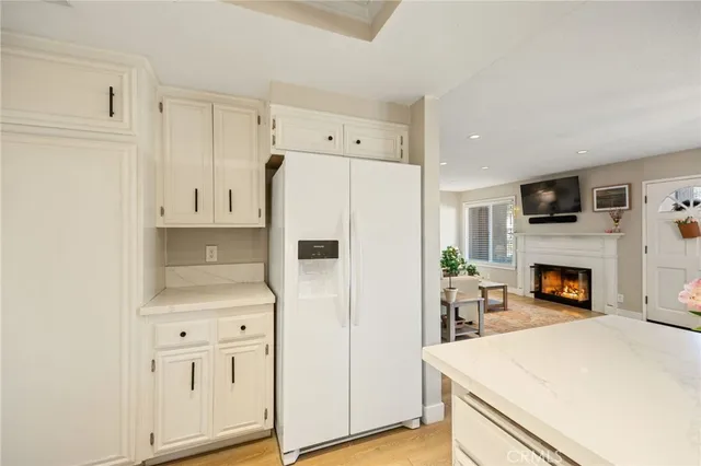 a white refrigerator freezer sitting in a kitchen