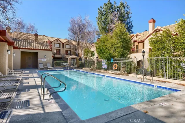 a view of a swimming pool with a patio
