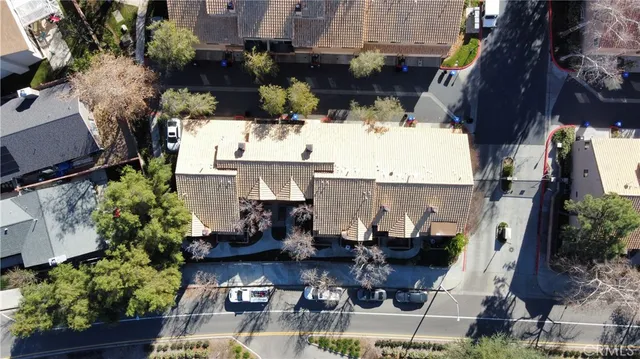 an aerial view of houses with outdoor space