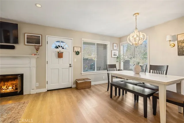 a view of a livingroom with furniture window and wooden floor