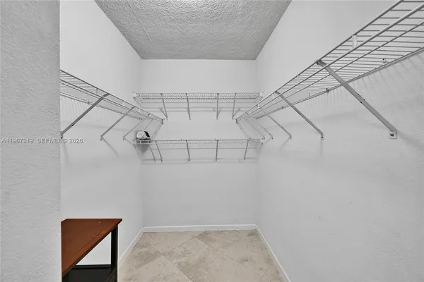 a view of a room with racks on the wall