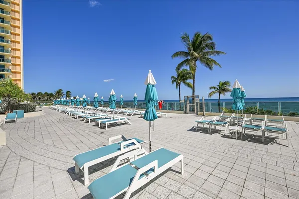 a view of a patio with swimming pool