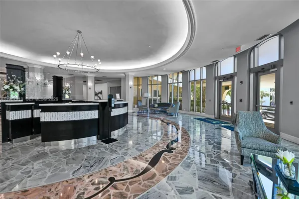 a large kitchen with granite countertop a stove a sink a counter space and dining table