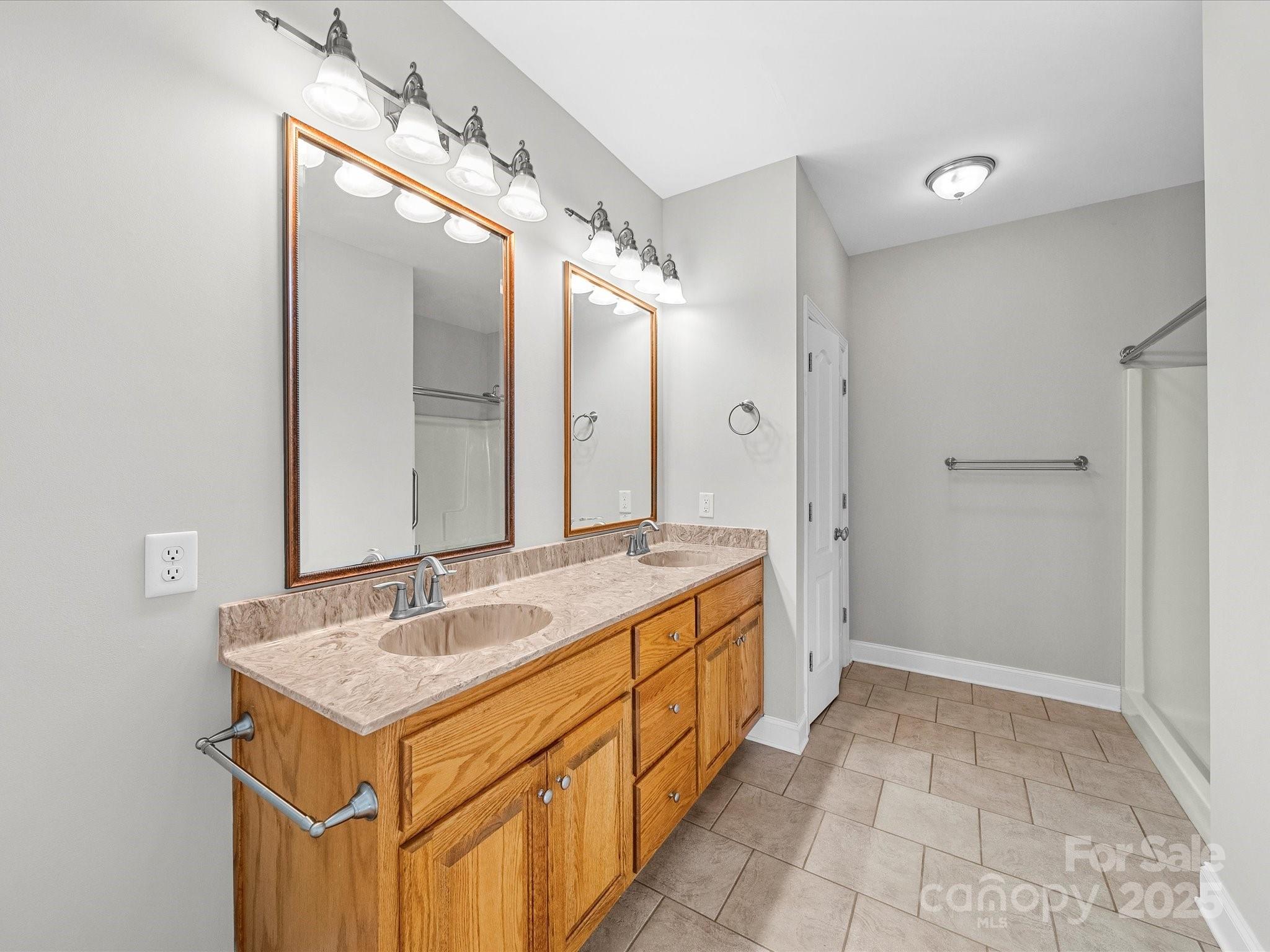 514 Clover Leaf Road Marshville, NC 28103 - Photo 13 of 48 a spacious bathroom with a sink and a mirror
