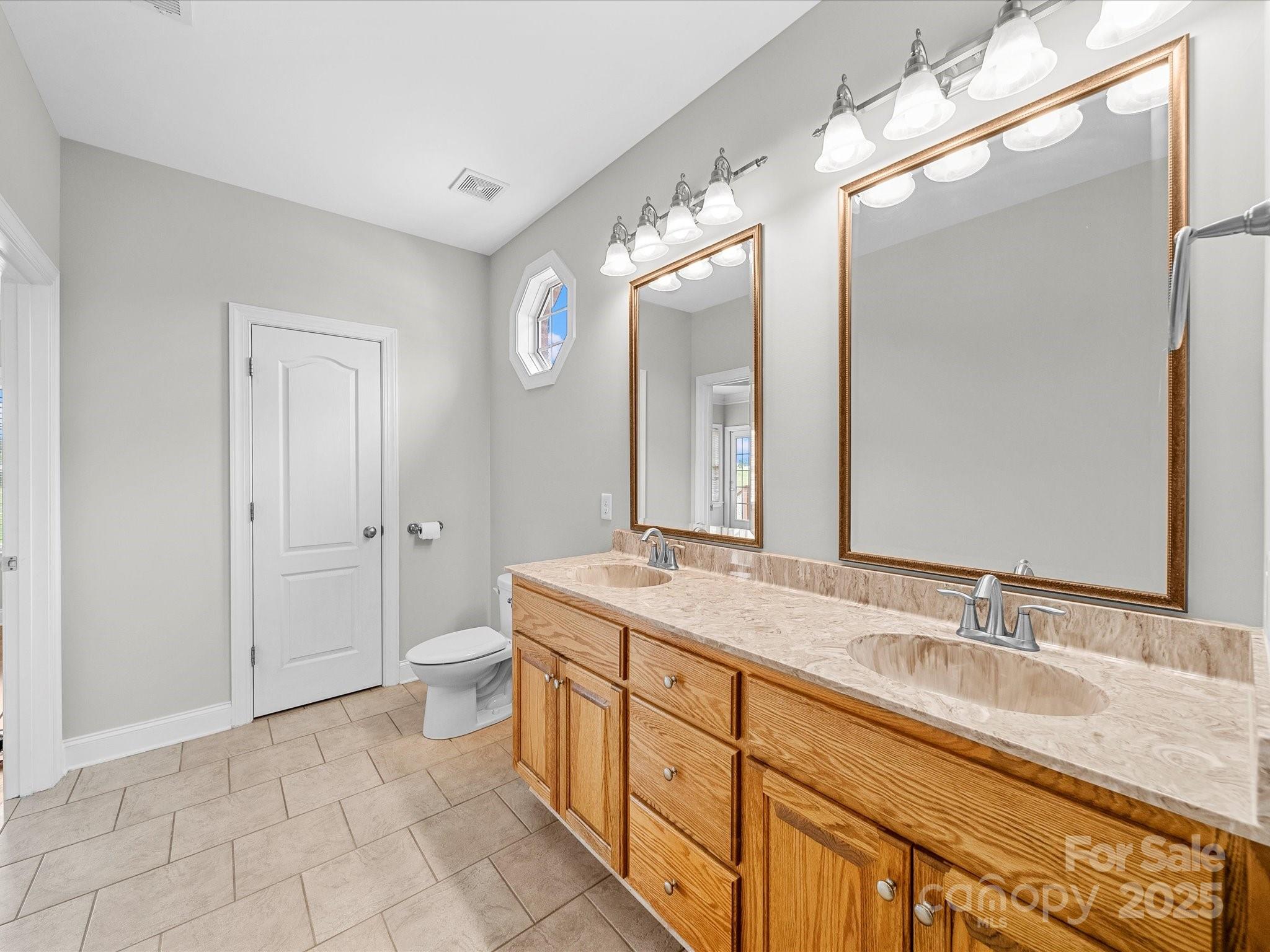 514 Clover Leaf Road Marshville, NC 28103 - Photo 15 of 48 a spacious bathroom with a granite countertop sink mirror and a