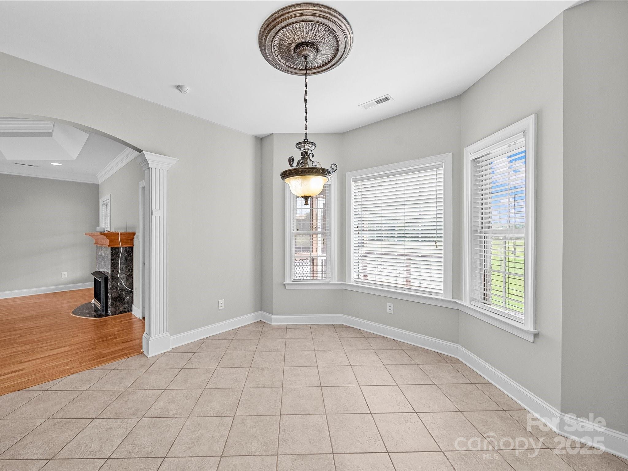 514 Clover Leaf Road Marshville, NC 28103 - Photo 17 of 48 a view of empty room with window and chandelier