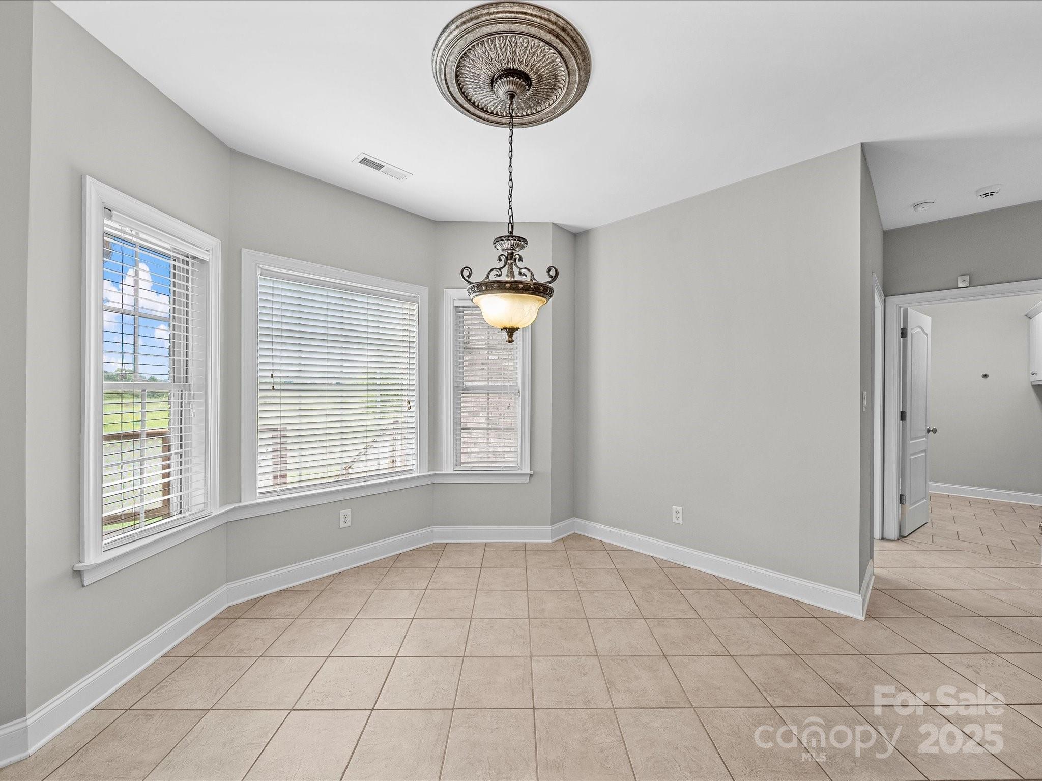 514 Clover Leaf Road Marshville, NC 28103 - Photo 18 of 48 a view of empty room with window and ceiling fan