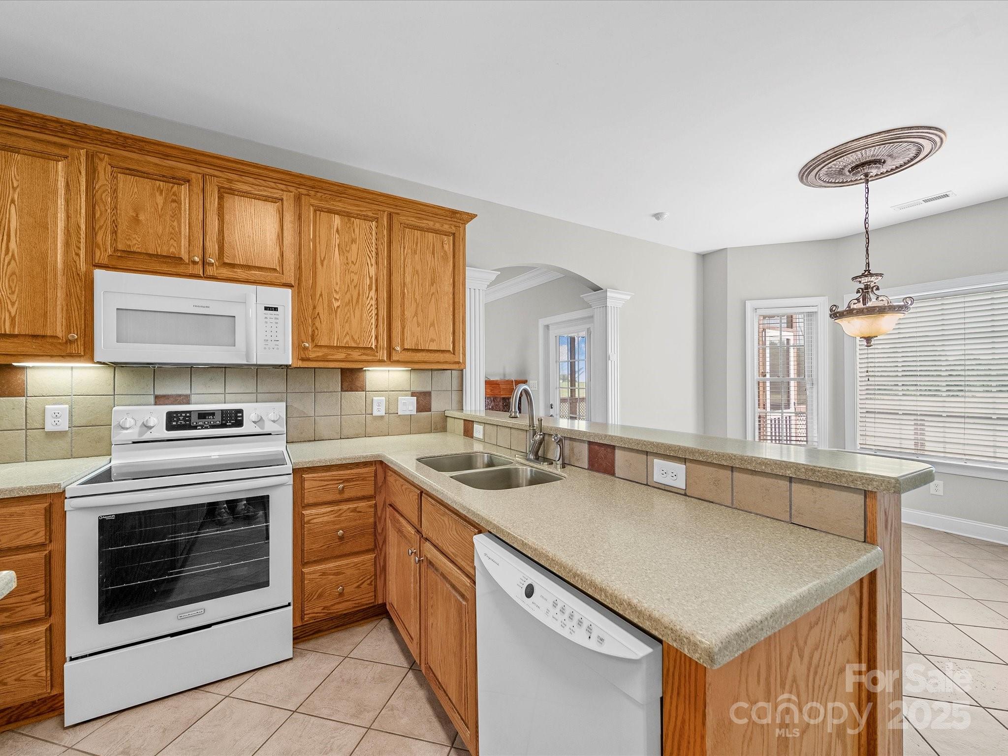 514 Clover Leaf Road Marshville, NC 28103 - Photo 21 of 48 a kitchen with stainless steel appliances granite countertop a sink stove and cabinets