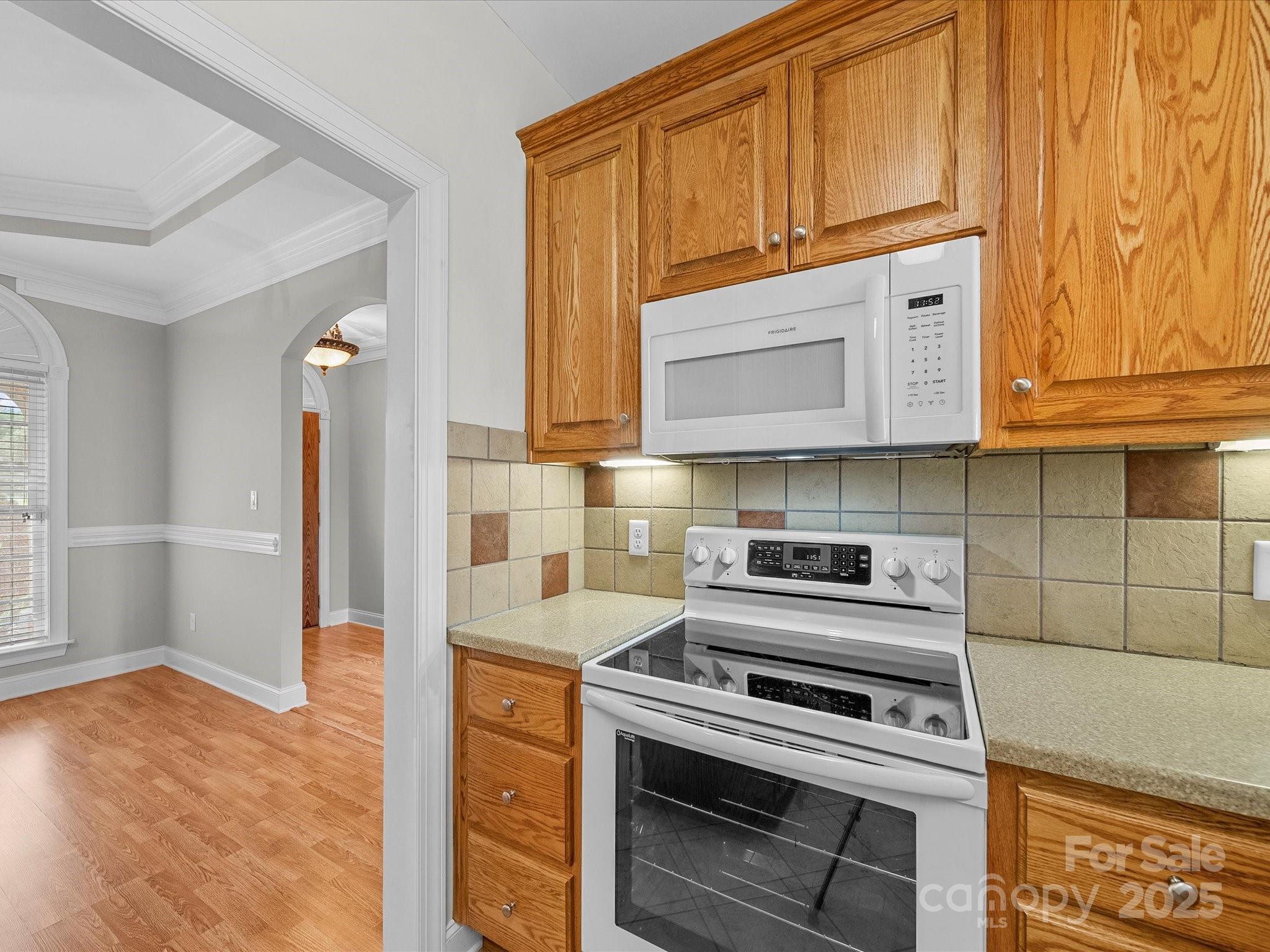 514 Clover Leaf Road Marshville, NC 28103 - Photo 22 of 48 a kitchen with stainless steel appliances granite countertop a stove a microwave and cabinets