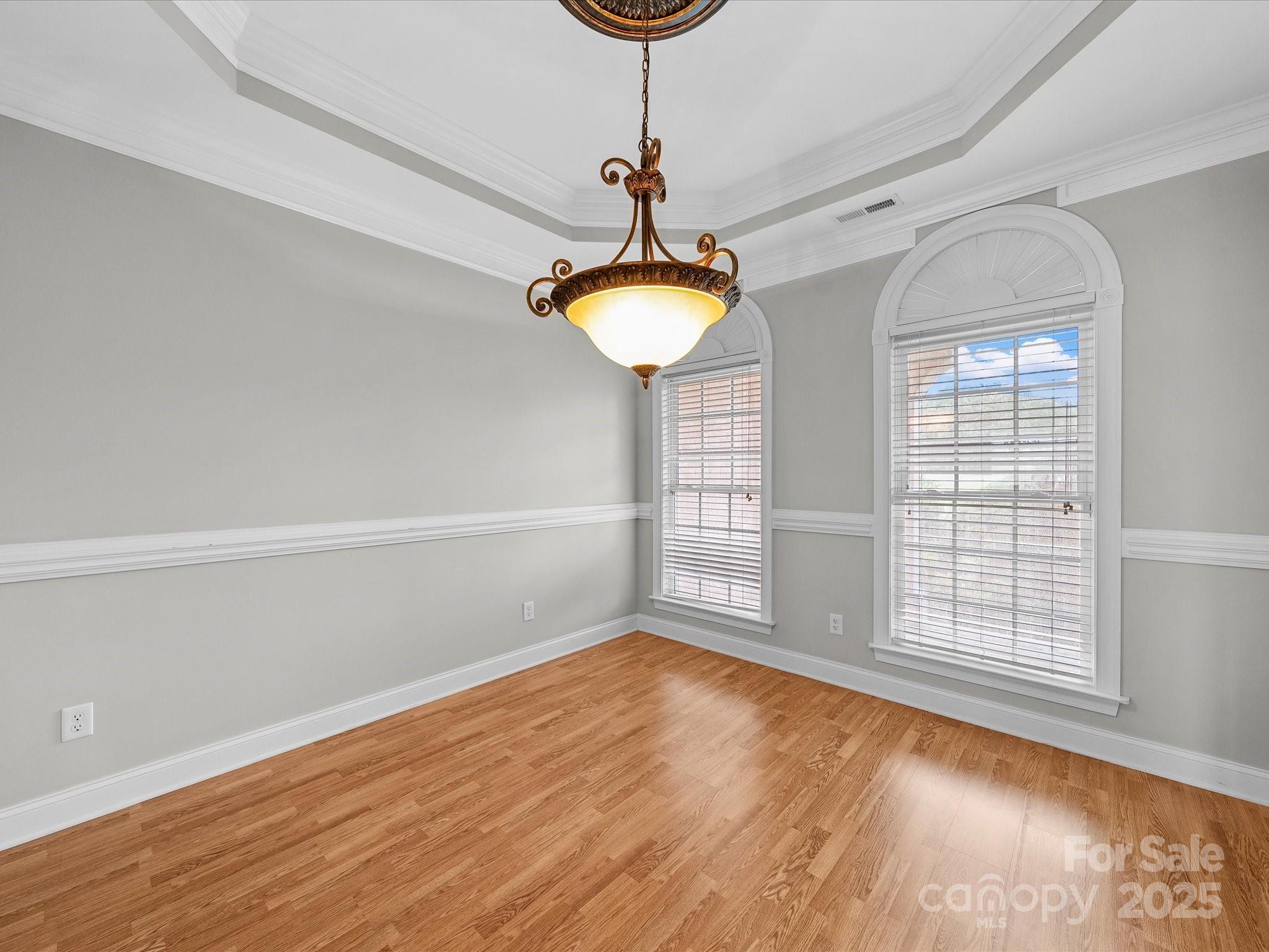 514 Clover Leaf Road Marshville, NC 28103 - Photo 23 of 48 a view of empty room with wooden floor and fan