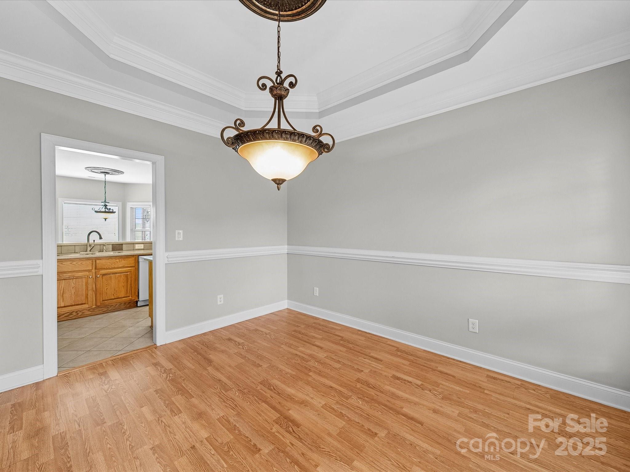 514 Clover Leaf Road Marshville, NC 28103 - Photo 24 of 48 a view of empty room with a sink and chandelier