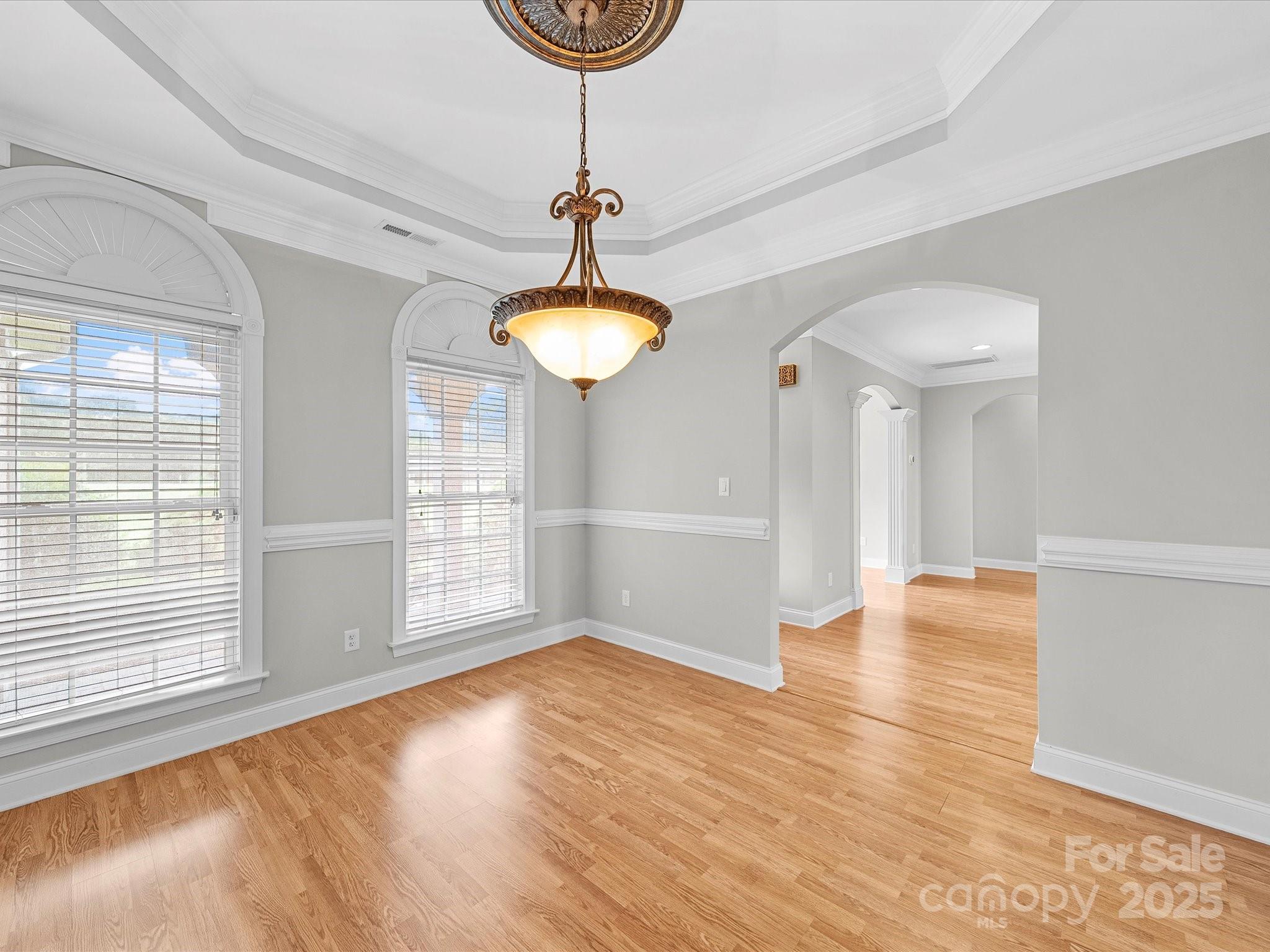 514 Clover Leaf Road Marshville, NC 28103 - Photo 27 of 48 a view of empty room with wooden floor and fan