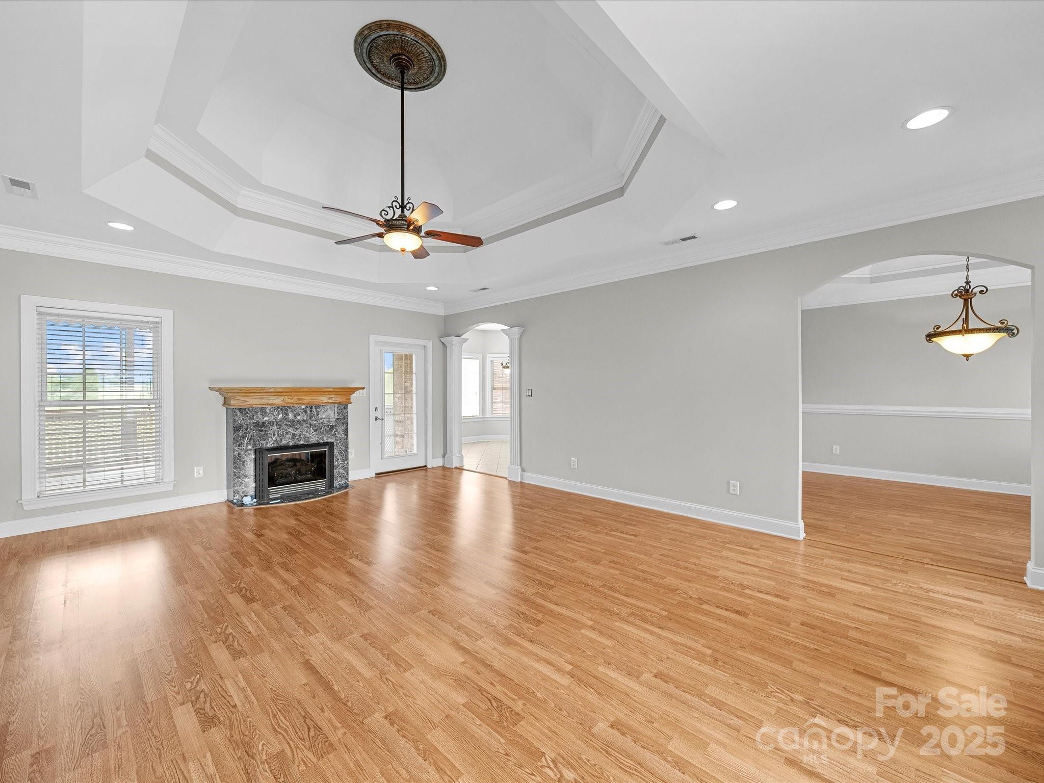 514 Clover Leaf Road Marshville, NC 28103 - Photo 28 of 48 a view of empty room with wooden floor and fireplace