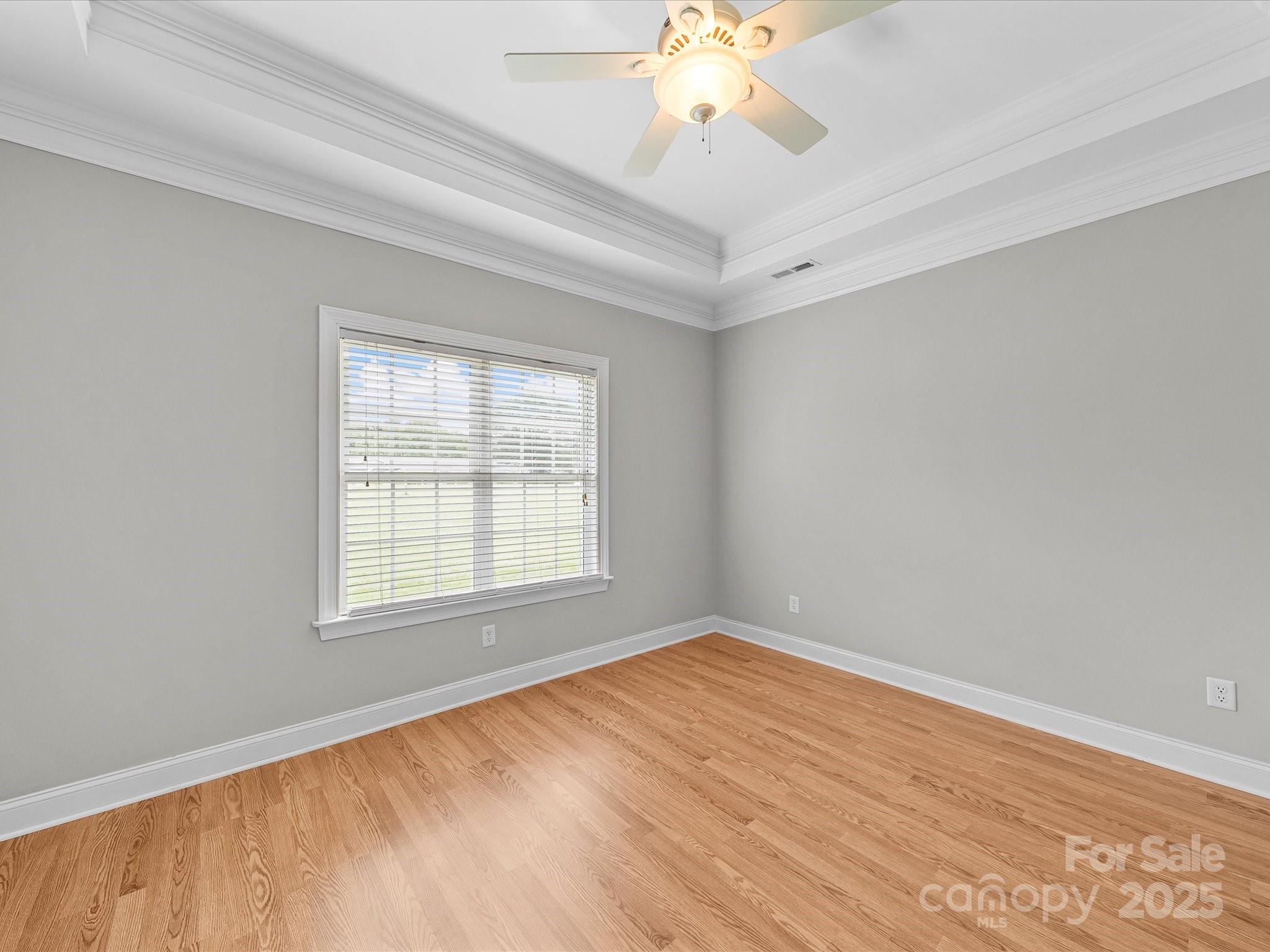 514 Clover Leaf Road Marshville, NC 28103 - Photo 33 of 48 an empty room with wooden floor and windows